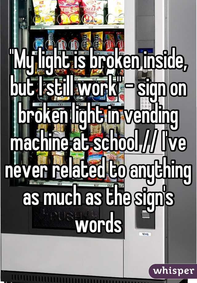 "My light is broken inside, but I still work" - sign on broken light in The Light Is Broken But I Still Work