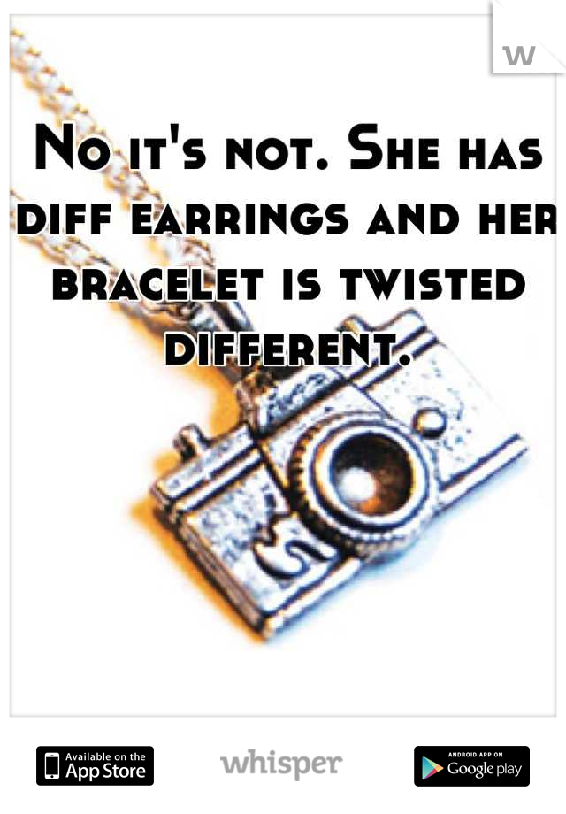 No it's not. She has diff earrings and her bracelet is twisted different.