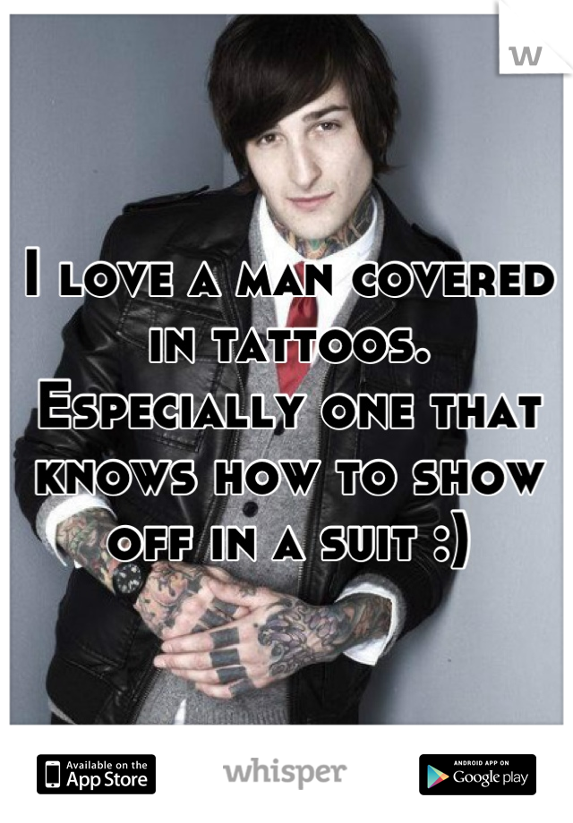 I love a man covered in tattoos.
Especially one that knows how to show off in a suit :)