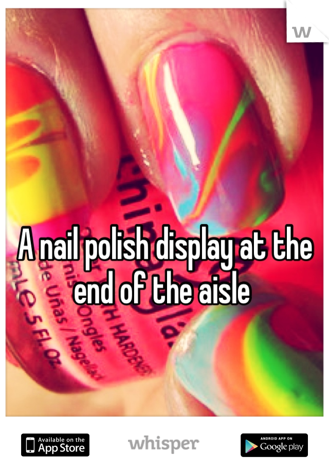 A nail polish display at the end of the aisle 