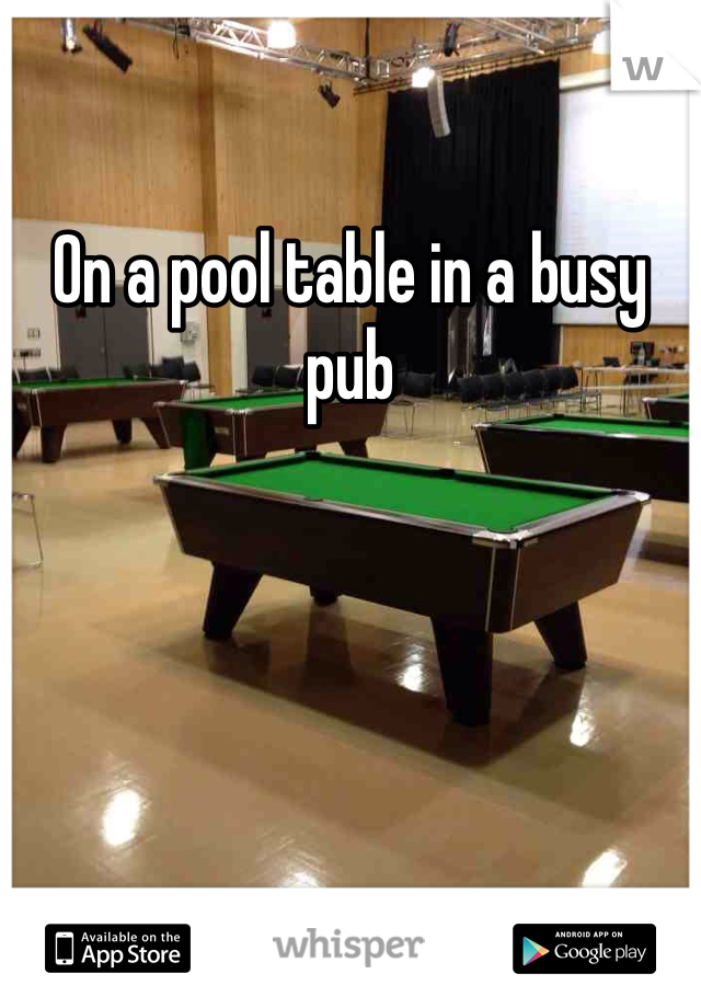 On a pool table in a busy pub 
