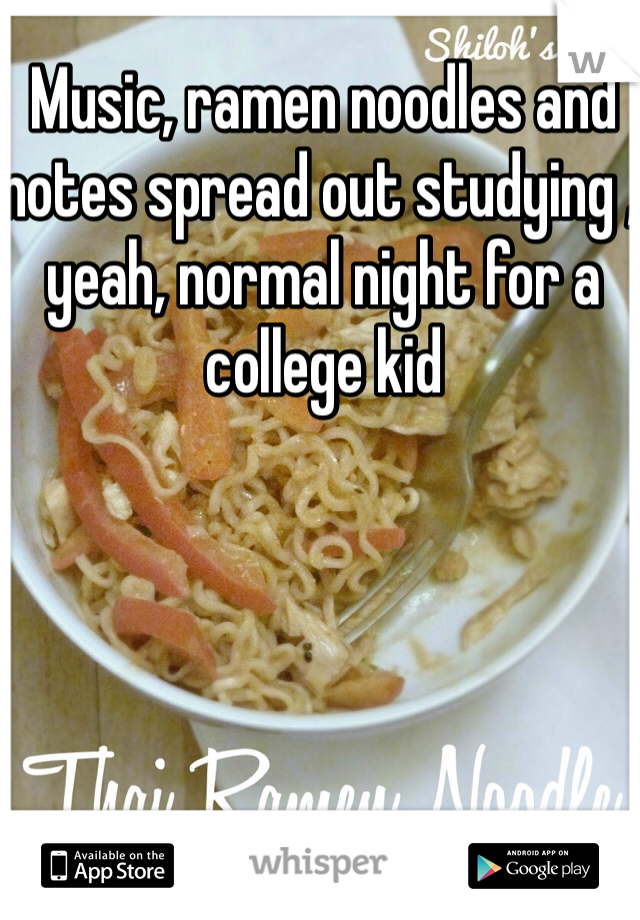 Music, ramen noodles and notes spread out studying , yeah, normal night for a college kid