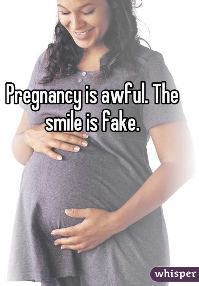 Pregnancy is awful. The smile is fake.