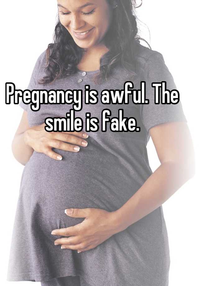 Pregnancy is awful. The smile is fake.