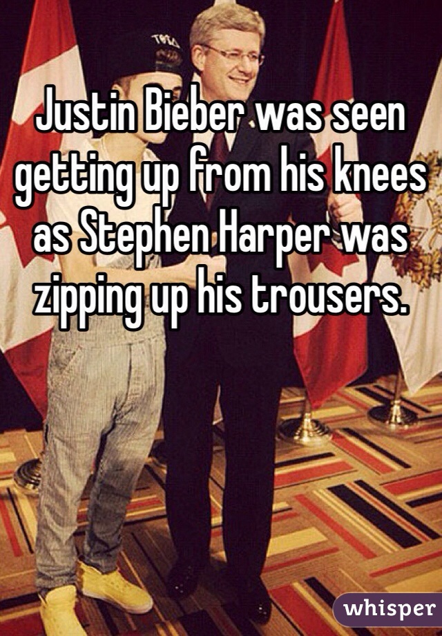 Justin Bieber was seen getting up from his knees as Stephen Harper was zipping up his trousers. 