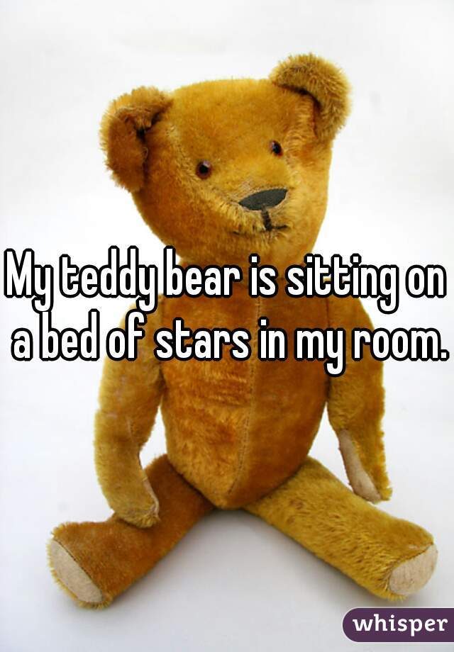 My teddy bear is sitting on a bed of stars in my room.