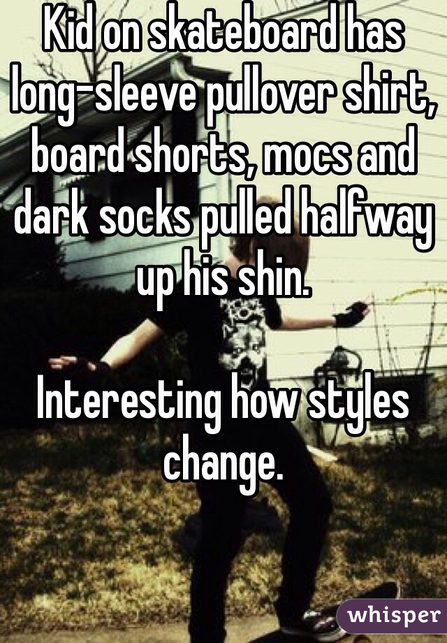 Kid on skateboard has long-sleeve pullover shirt, board shorts, mocs and dark socks pulled halfway up his shin. 

Interesting how styles change.