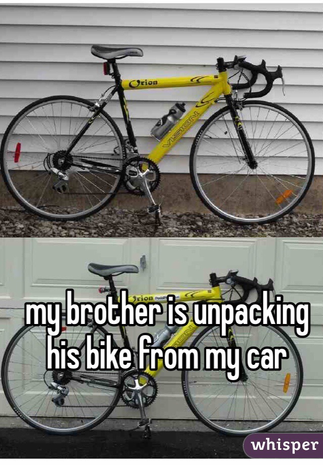 my brother is unpacking his bike from my car 