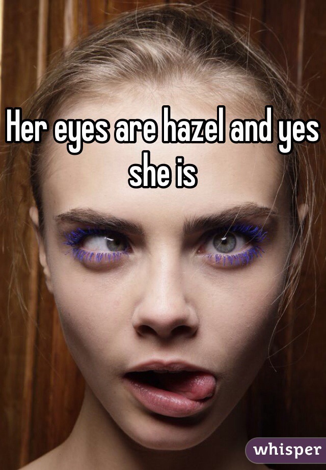 Her eyes are hazel and yes she is