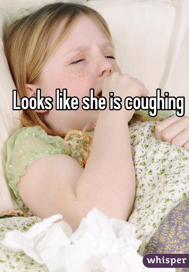 Looks like she is coughing 