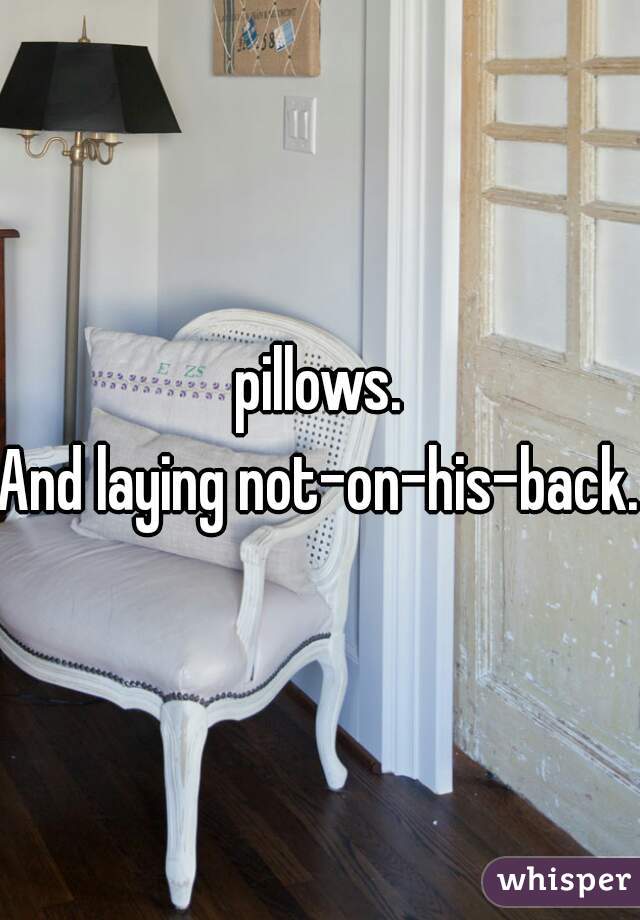 pillows.
And laying not-on-his-back.