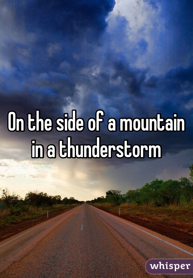 On the side of a mountain in a thunderstorm