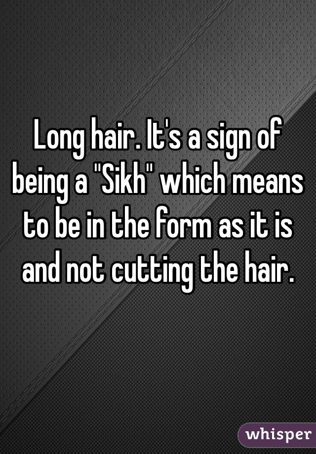 Long hair. It's a sign of being a "Sikh" which means to be in the form as it is and not cutting the hair. 

