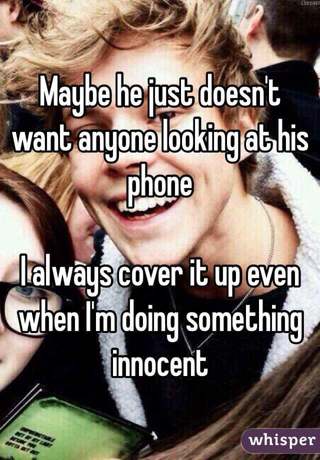 Maybe he just doesn't want anyone looking at his phone

I always cover it up even when I'm doing something innocent