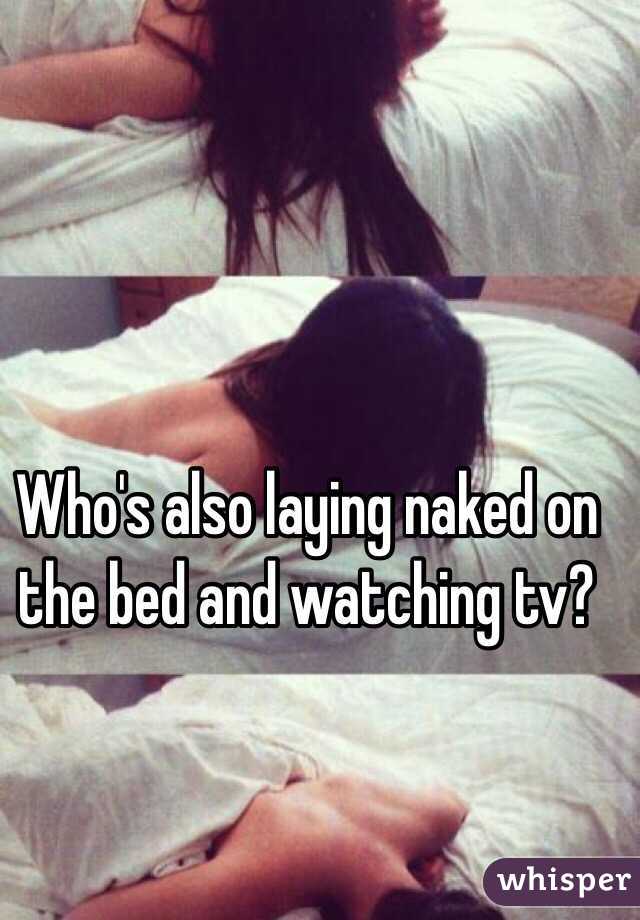 Who's also laying naked on the bed and watching tv? 