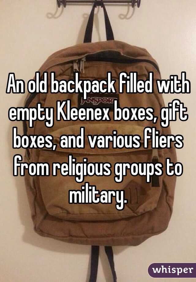 An old backpack filled with empty Kleenex boxes, gift boxes, and various fliers from religious groups to military. 