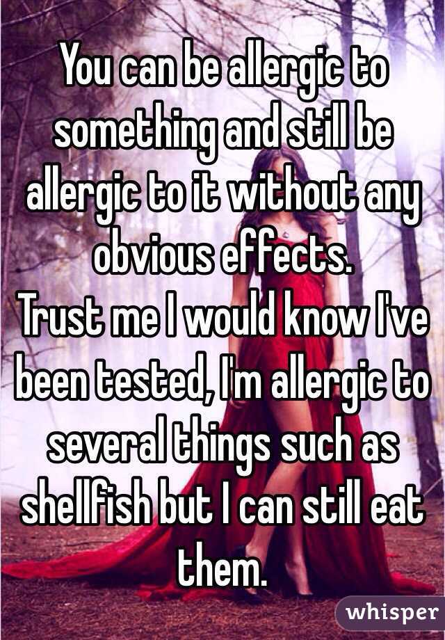 You can be allergic to something and still be allergic to it without any obvious effects. 
Trust me I would know I've been tested, I'm allergic to several things such as shellfish but I can still eat them. 