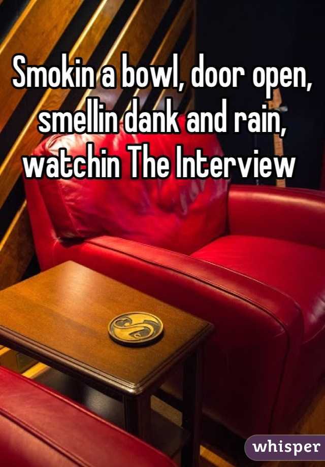 Smokin a bowl, door open, smellin dank and rain, watchin The Interview 