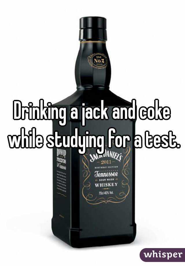 Drinking a jack and coke while studying for a test.