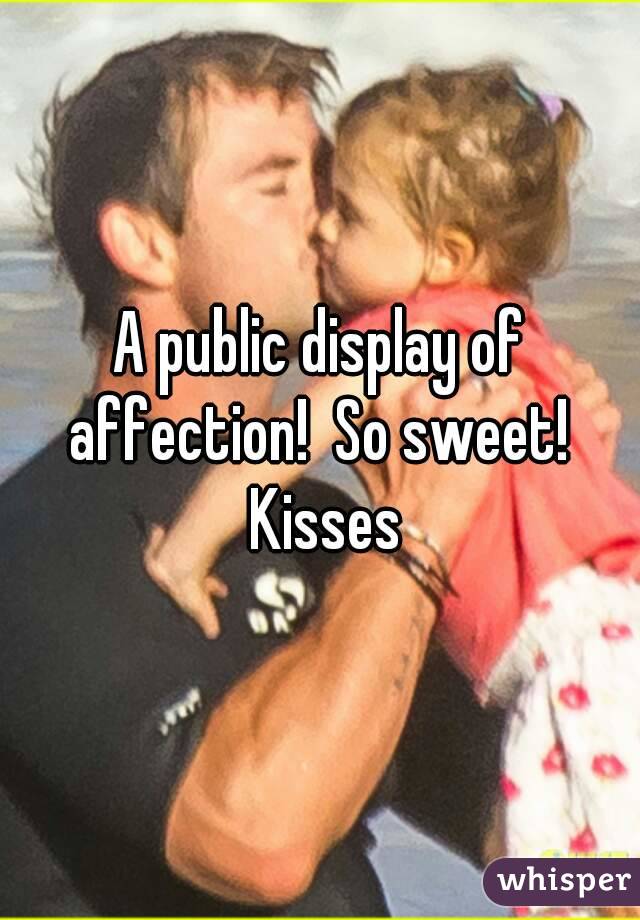 A public display of affection!  So sweet!  Kisses