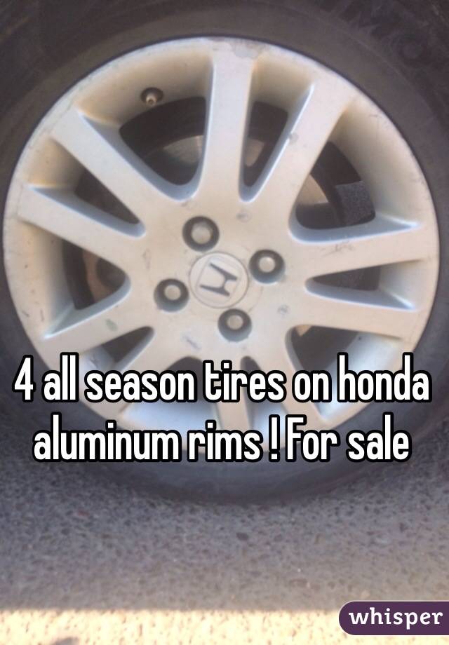 4 all season tires on honda aluminum rims ! For sale