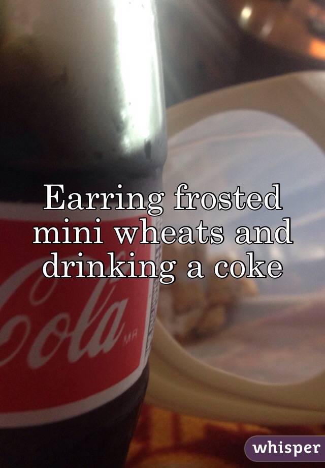 Earring frosted mini wheats and drinking a coke
