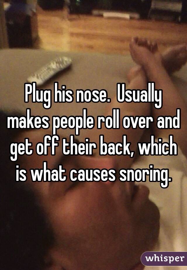 Plug his nose.  Usually makes people roll over and get off their back, which is what causes snoring.