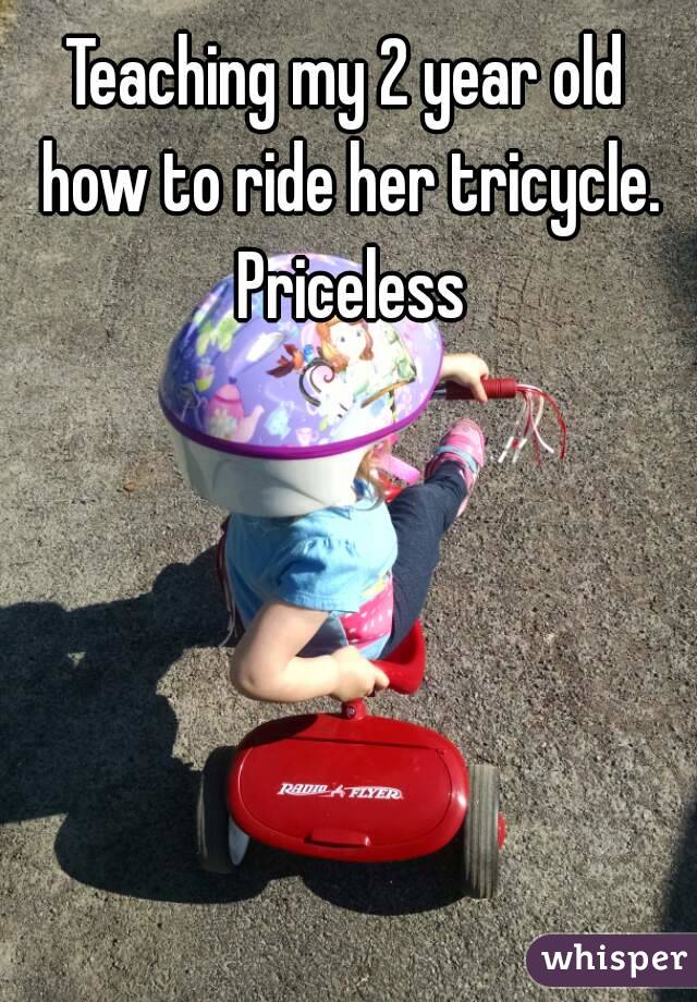 Teaching my 2 year old how to ride her tricycle. Priceless