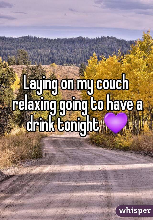 Laying on my couch relaxing going to have a drink tonight 💜