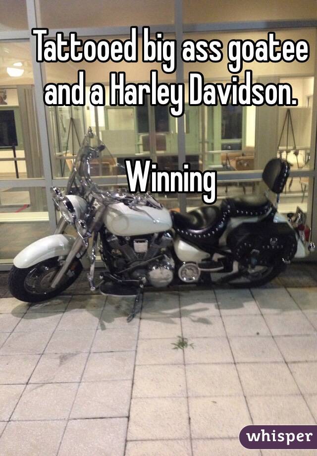 Tattooed big ass goatee and a Harley Davidson.

Winning