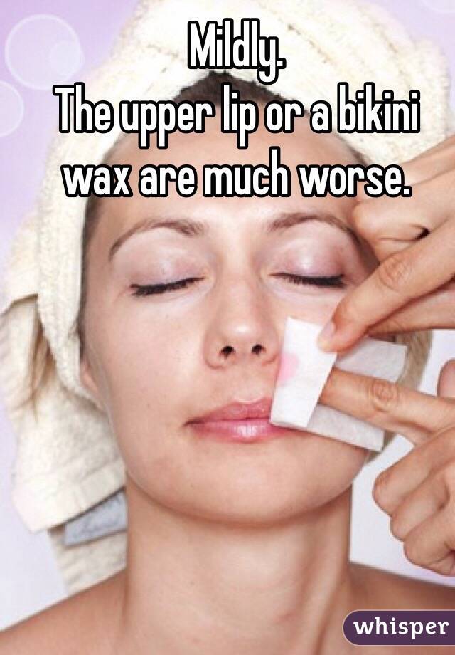 Mildly.
The upper lip or a bikini wax are much worse.