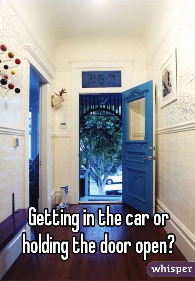 Getting in the car or holding the door open?