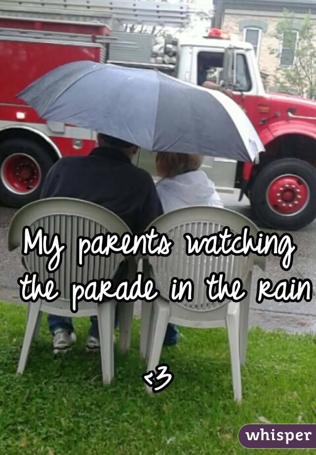 My parents watching the parade in the rain 
<3