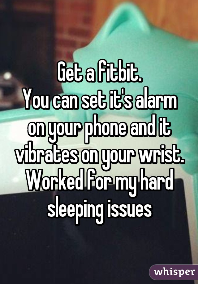 Get a fitbit.
You can set it's alarm on your phone and it vibrates on your wrist.
Worked for my hard sleeping issues