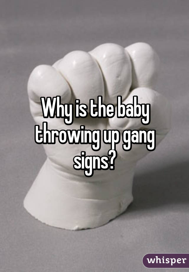 Why is the baby throwing up gang signs?