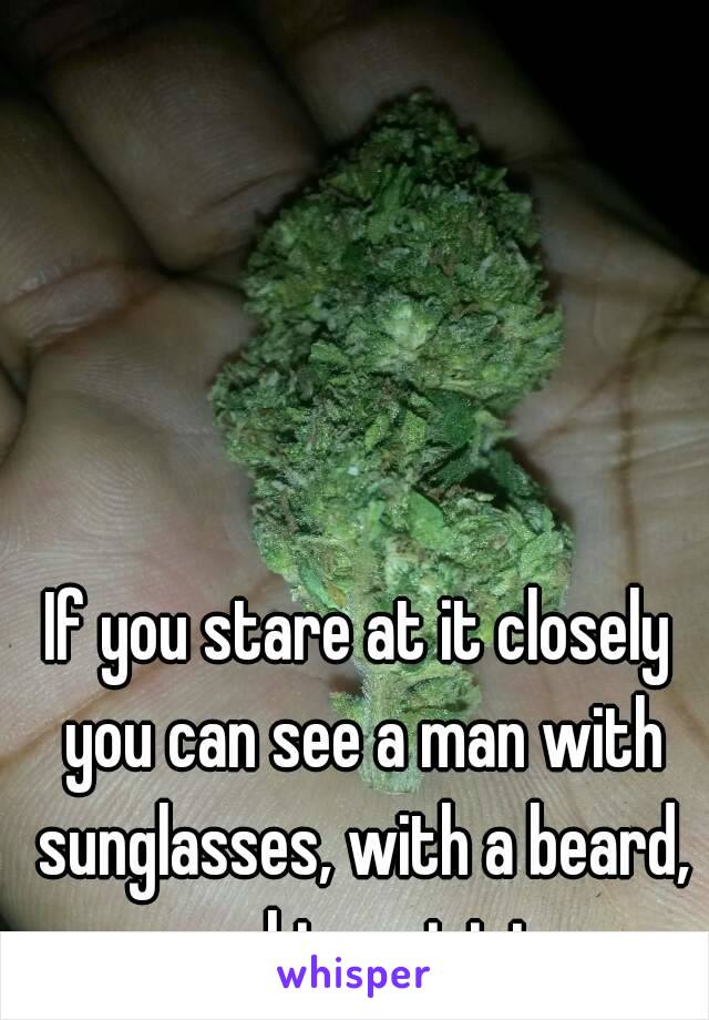 If you stare at it closely you can see a man with sunglasses, with a beard, smoking a joint. 