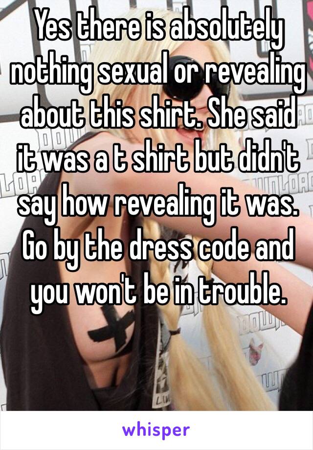 Yes there is absolutely nothing sexual or revealing about this shirt. She said it was a t shirt but didn't say how revealing it was. Go by the dress code and you won't be in trouble.