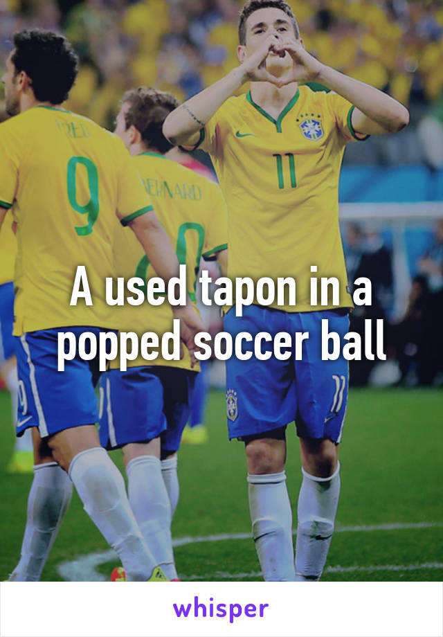 A used tapon in a popped soccer ball