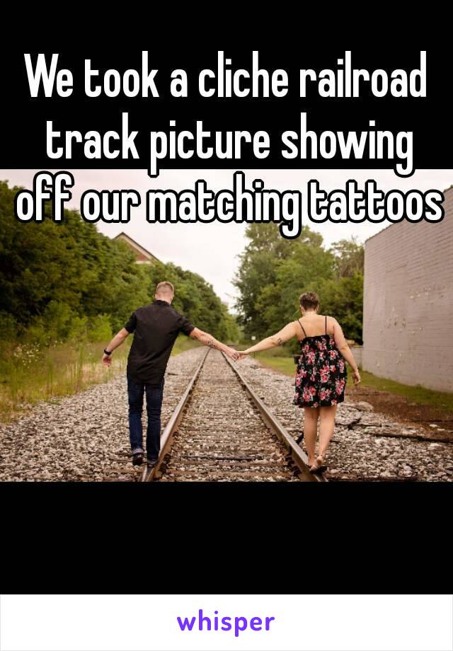 We took a cliche railroad track picture showing off our matching tattoos