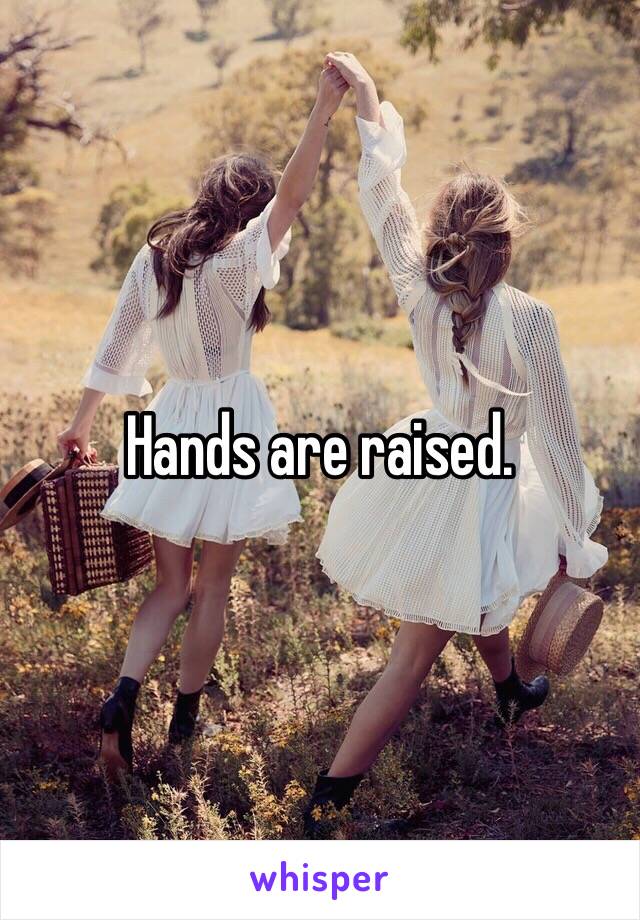 Hands are raised.