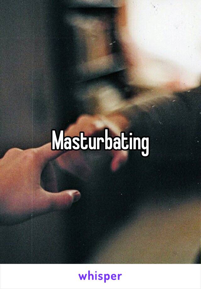 Masturbating