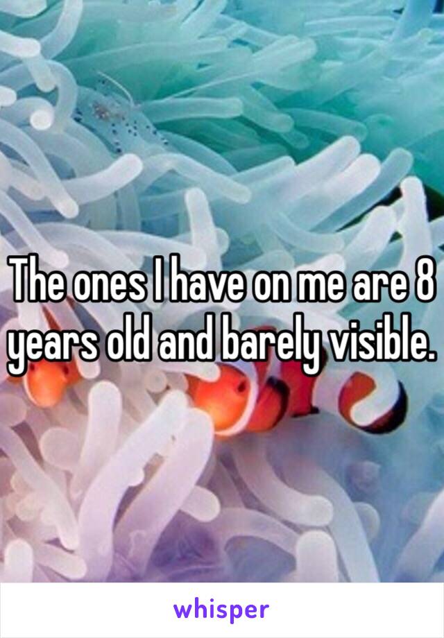 The ones I have on me are 8 years old and barely visible.