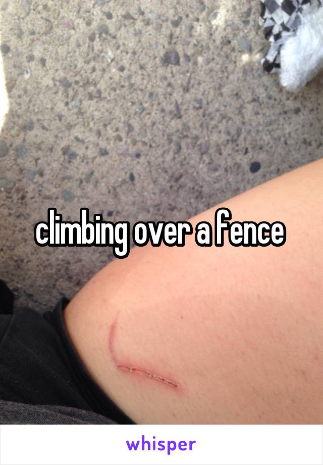 climbing over a fence 