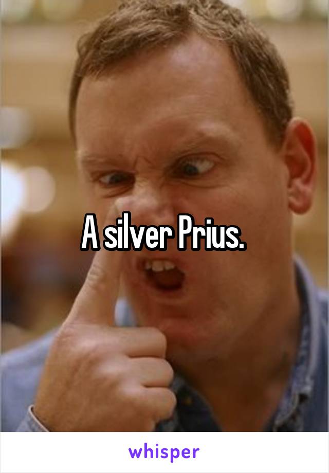 A silver Prius. 