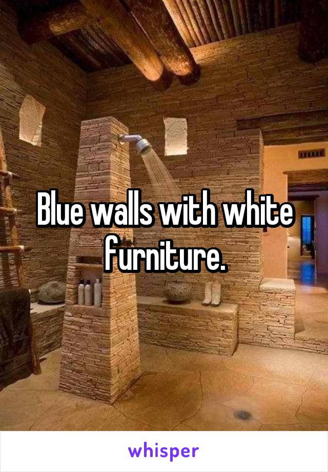 Blue walls with white furniture.