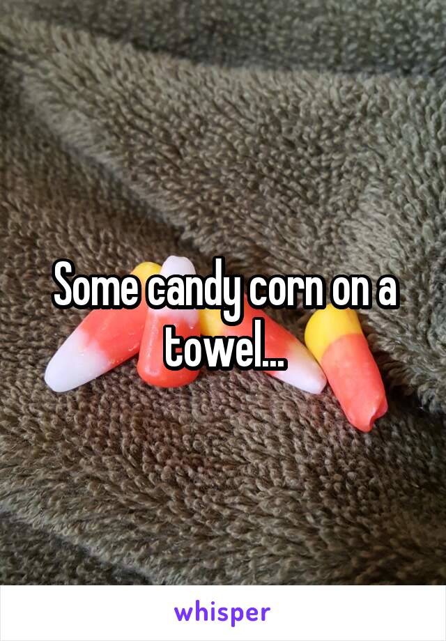 Some candy corn on a towel...