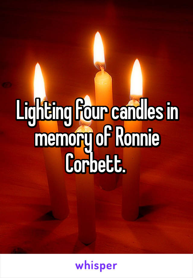 Lighting four candles in memory of Ronnie Corbett. 