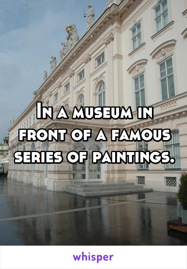 In a museum in front of a famous series of paintings.