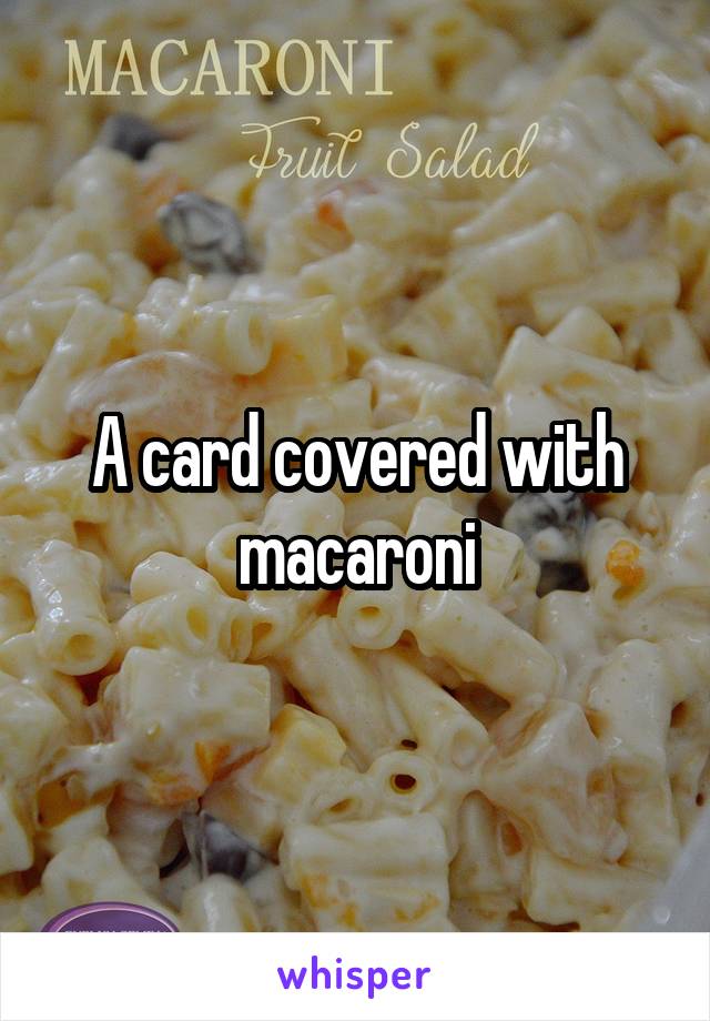 A card covered with macaroni