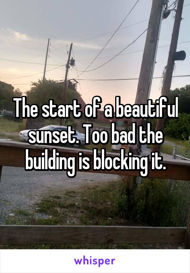 The start of a beautiful sunset. Too bad the building is blocking it.